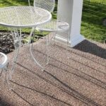 How does an outdoor carpet hold up in different weather conditions